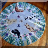 D27. Hooked cat rug.